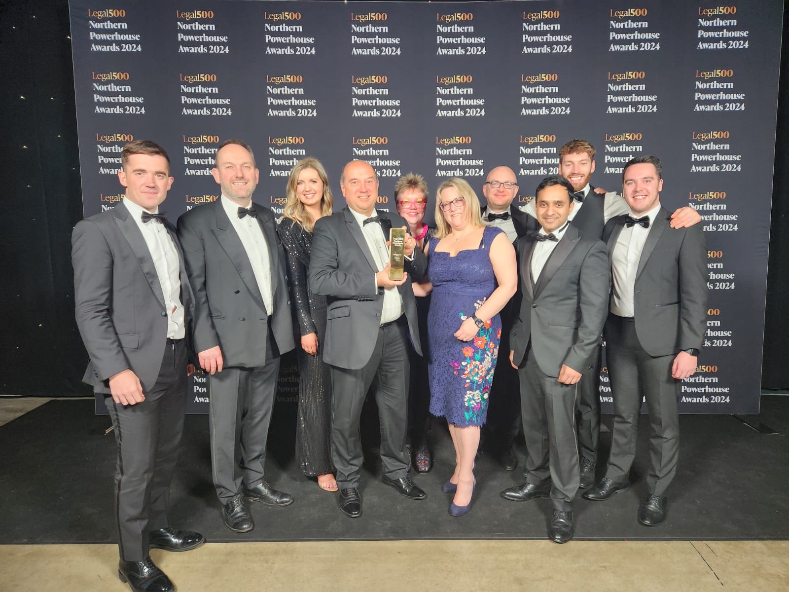 The Weightmans team pose with their award