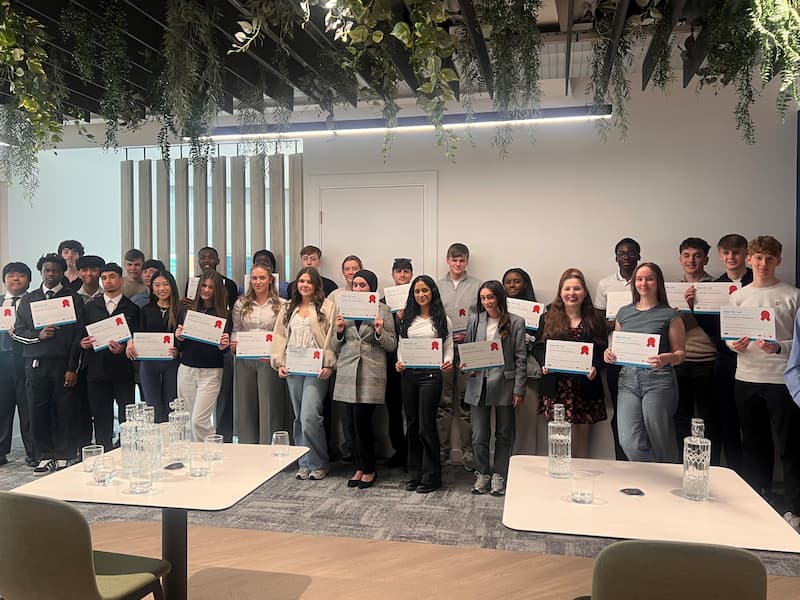 Members of the step into law programme showing off their certificates