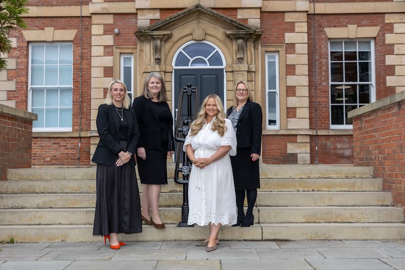 The members of the Nottingham office outside the new office with Managing Partner, Sarah Walton