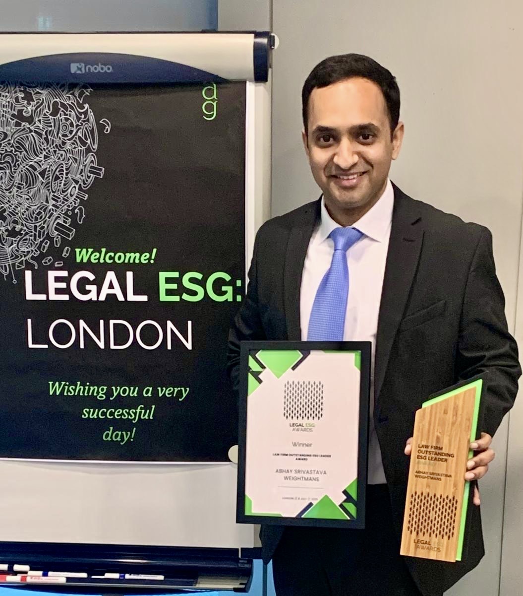 Abhay Srivastava poses with his award